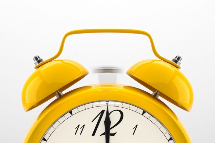 A yellow alarm clock