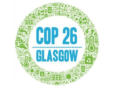 An illustration shows a green circle comprised of icons of sustainability. A blue title in the middle of the circle reads, "COP 26 Glasgow".